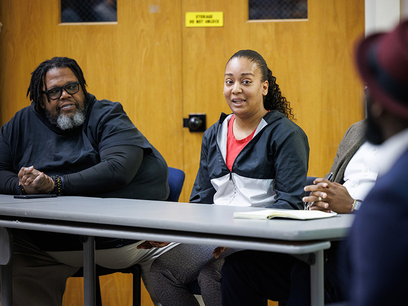 Zenani Kidd, center, speaks during the panel discussion of Ewoodzie's book.